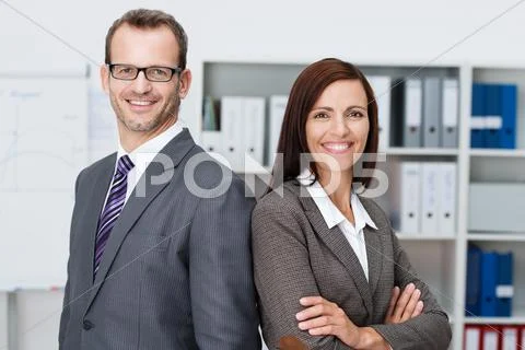 Smiling professional business man and woman Stock Photos