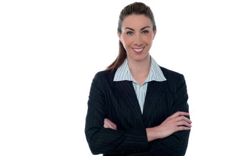 Smiling professional lady posing with arms crossed Stock Photos
