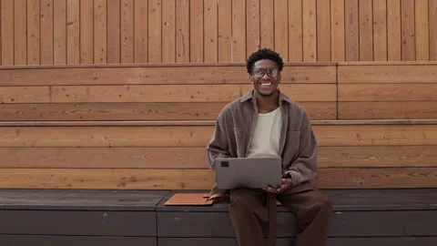 Smiling Programmer on Bench Video stock 320006815