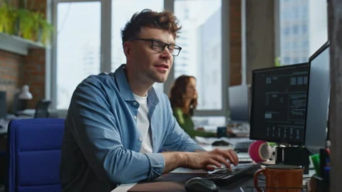 Smiling programmer coding keyboard drawing graphic tablet at office closeup Stock Footage 282744137