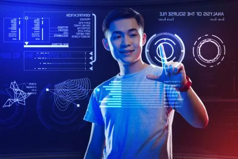 Smiling programmer looking happy while touching visual elements on the screen Stock Photos