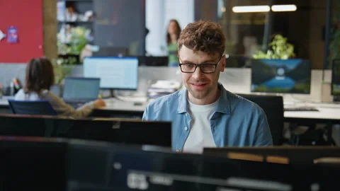 Smiling programmer typing keyboard working computer at office workplace closeup 스톡 동영상 282737685