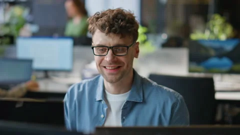 Smiling programmer working computer corporate workplace closeup. Man looking pc Stock Footage 282742265