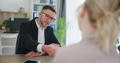 Smiling Real Estate Agent Shakes Hands During Negotiations Stock Footage 281117359