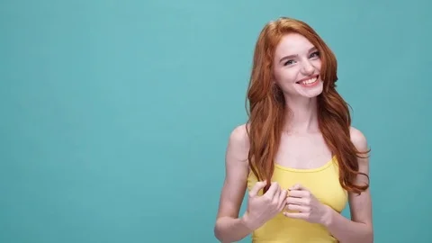 Smiling redhead woman showing copy space Stock Footage