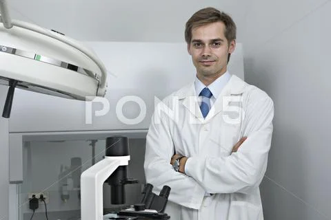 A smiling research technician standing in a research lab Stock Photos
