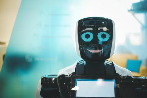 Smiling robot assistant with artificial intelligence in public place Stock Photos