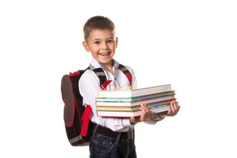 Smiling school boy with backpack holding notebooks, on white background Stock Photos