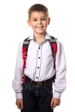 Smiling school boy with backpack, ready to school on white background Stock Photos
