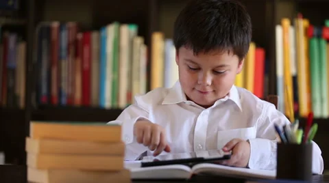 Smiling school boy using digital tablet Stock Footage 46025567