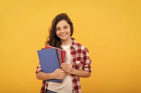 Smiling school child ready to study with copybooks, knowledge Stock Photos