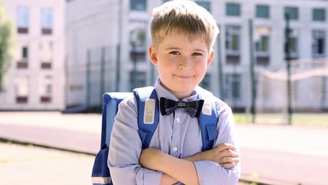  Smiling  schoolboy of an elementary school.  Funny child on the background of s Stock Footage 78875412