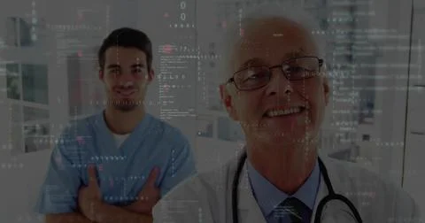 Smiling senior-doc standing right in hall, in white-coat, stethoscope, 스톡 사진