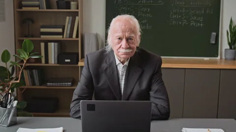Smiling Senior Man at Desk in Computer Class Stock Footage 333709463