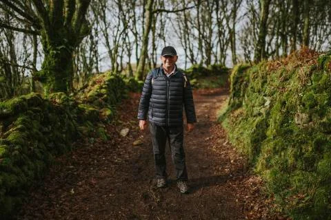 Smiling senior man doing the pilgrimage in the Camino de Santiago way. Stock Photos