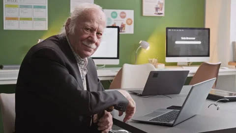 Smiling Senior Man with Laptop in Computer Literacy Class Stock Footage 333703488