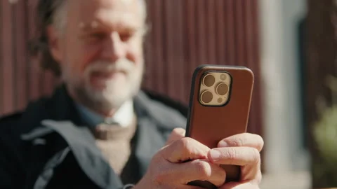Smiling Senior Man Using Smartphone Outdoors Stock Footage 316096695