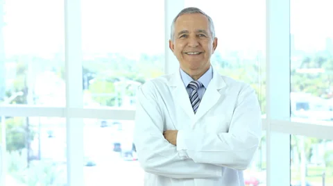 Smiling senior man wearing lab coat Stock Footage 33577573