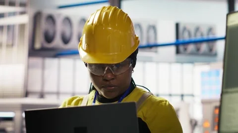 Smiling smart factory specialist testing automated systems to ensure reliability Stock Footage 308712622