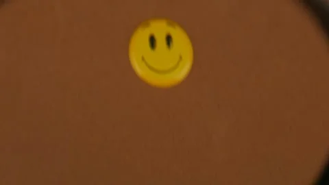 Smiling Smiley Face Under Magnifying Glass Stock Footage 303267979