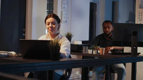 Smiling software developer planning network report on laptop Stock Footage 224451552