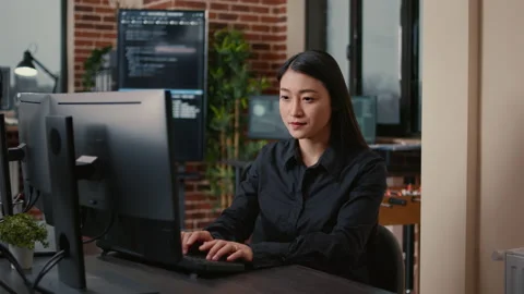 Smiling software developer typing machine learning app code on computer keyboard Stock Footage 168240788