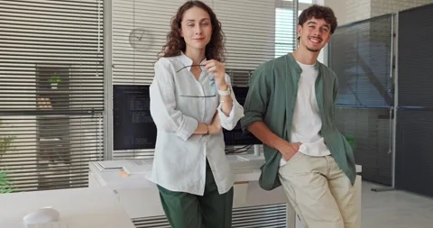 Smiling Software Developers Posing in Contemporary Open Plan Office Workspace Stock Footage 345880348