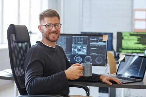 Smiling Software Programmer at Workplace 스톡 사진