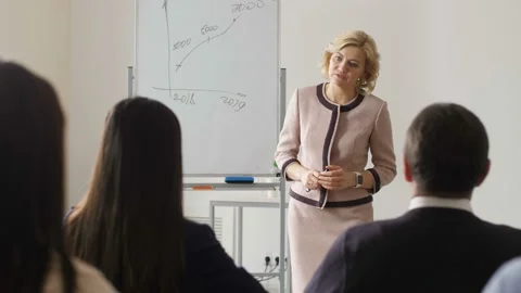 Smiling speaker giving detailed answer to question Stock Footage 108009859