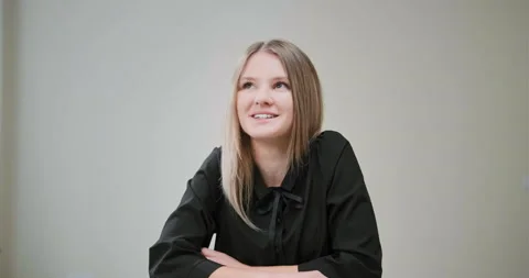 Smiling student in blouse talks looking into computer camera Stock-Footage 146254238