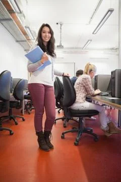 Smiling student in a computer room 스톡 사진