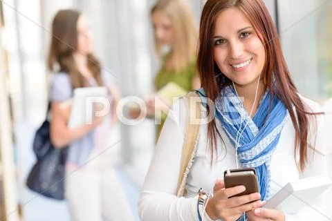 Smiling student listen music at high school Stock Photos