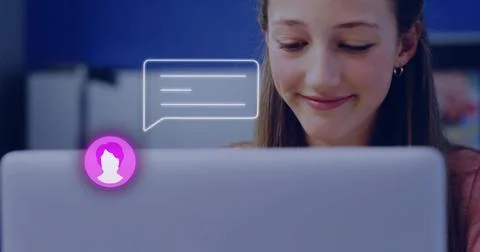 Smiling student in pink top checking chat, purple avatar on laptop in study a Stock Photos