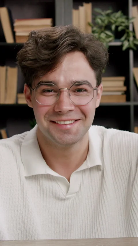 Smiling student raise hands during lecture sitting at desk Stock Footage 313926772