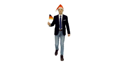 Smiling student in santa hat walking with flag of Germany, alpha in Video stock 121570382
