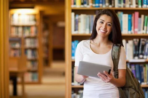 Smiling student using a tablet computer Stock Photos