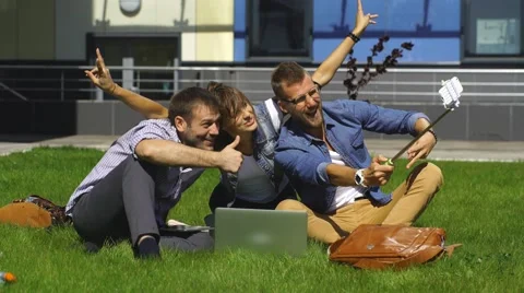 Smiling students taking a selfie outdoor at park Stock Footage 67832368