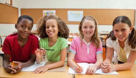 Smiling students working together Stock Photos