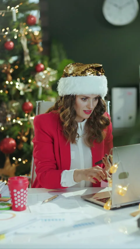 Smiling stylish in red jacket using smartphone app and working Stock Footage 294105722