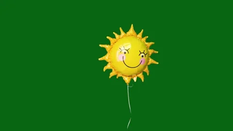 Smiling sun foil balloon floating upwards isolated on green background. Stock Footage 343101064