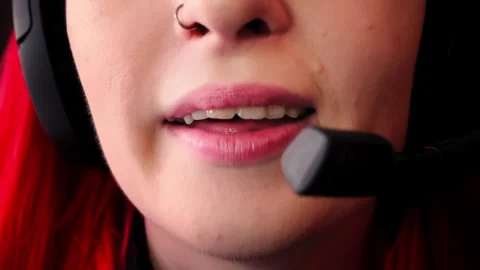 Smiling support agent wearing headset with microphone close to mouth is engaged Stock Footage 343948064