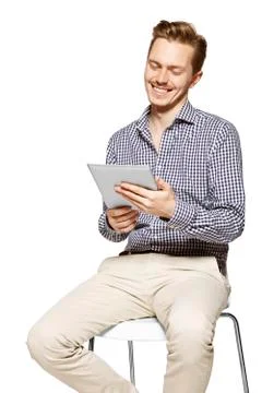 Smiling to the tablet Foto stock