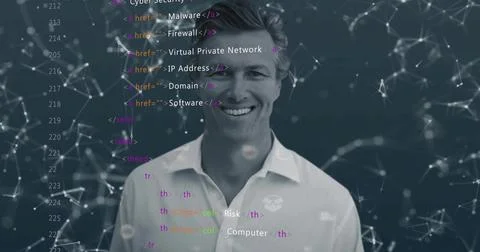 Smiling tech pro wearing white-collared shirt with logo in studio, showing co Stock Photos