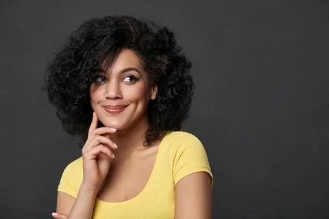 Smiling thinking wooman looking to side at copy space Stock Photos