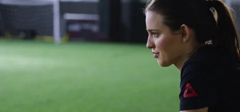Smiling trainer watching athlete running back and forth in fitness studio 動画素材 78205389