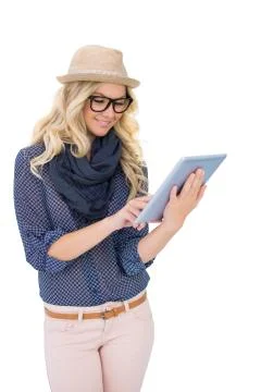 Smiling trendy blonde using tablet computer Foto stock