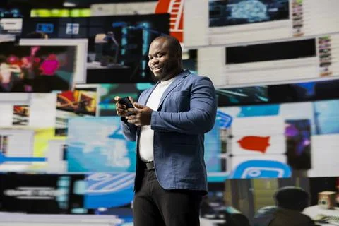 Smiling user navigating through online content and mobile apps 写真素材