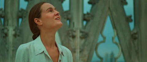 Smiling visitor enjoys gothic rooftop architecture of Duomo di Milano in Italy Stock Footage 313702937