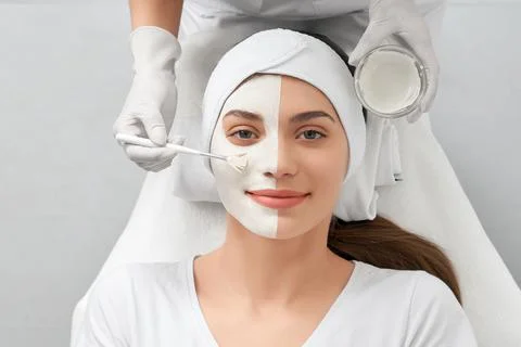 Smiling woman on beauty salon doing special procedure. Stock Photos