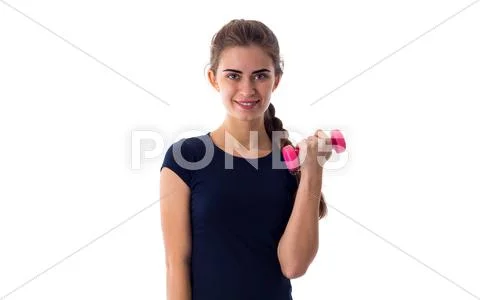 Smiling woman holding a dumbbell Stock Photos